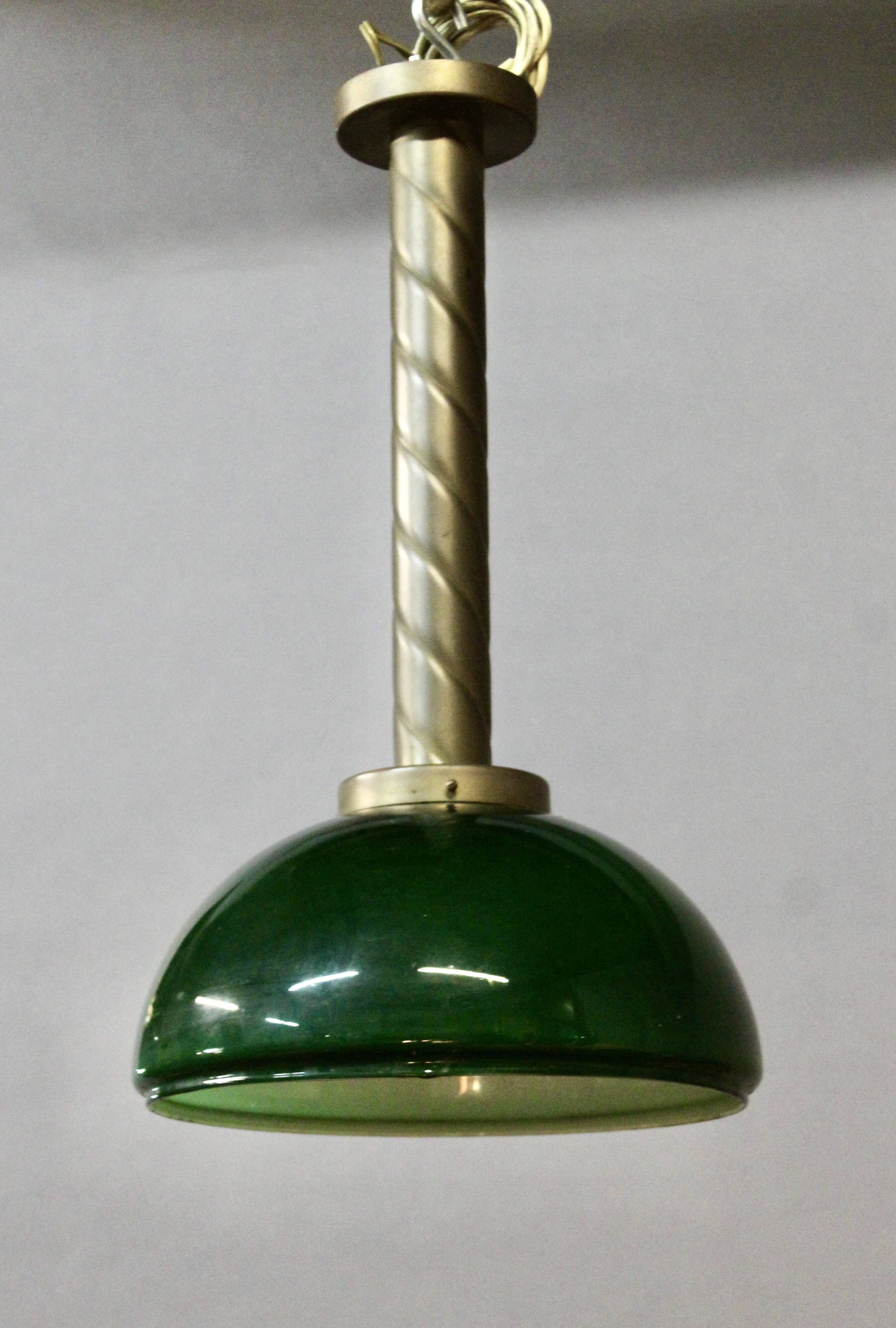 Chandelier with brass body and green opaline
