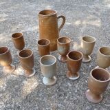 Service mazagrans and decanter in enamelled stoneware.