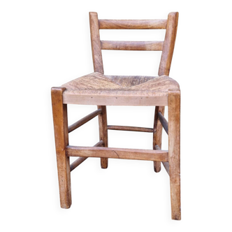Antique straw chair with low back