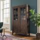 Vintage display cabinet/shelf in dark wood with glass.