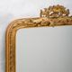 Louis-Philippe mirror from the 19th century with a ribbon trompe-l'œil frame.