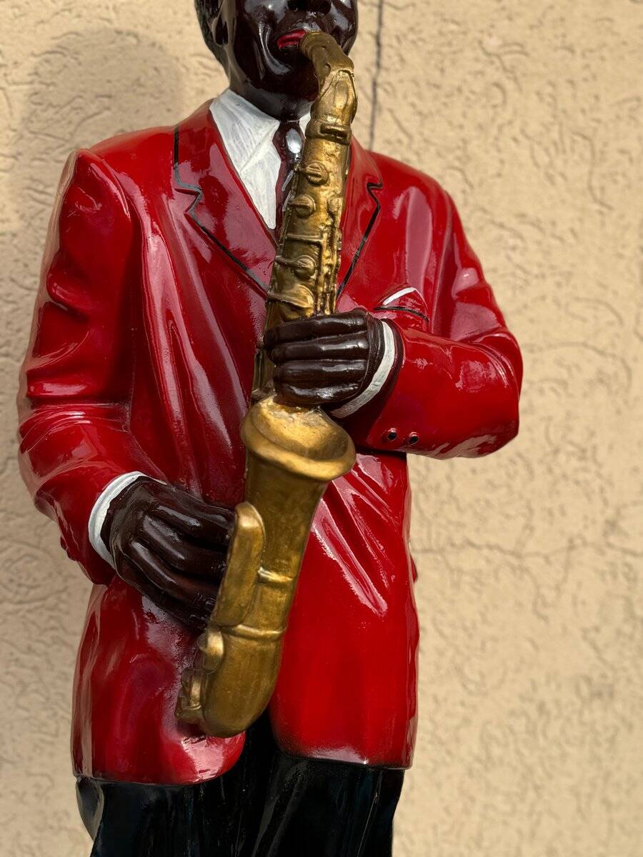 Large black and red jazz figurine in fibreglass, decorative sculpture from the 1960s.