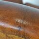 Sheepskin leather wingback armchair, with nails and black piping