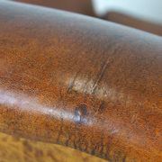 Sheepskin leather wingback armchair, with nails and black piping