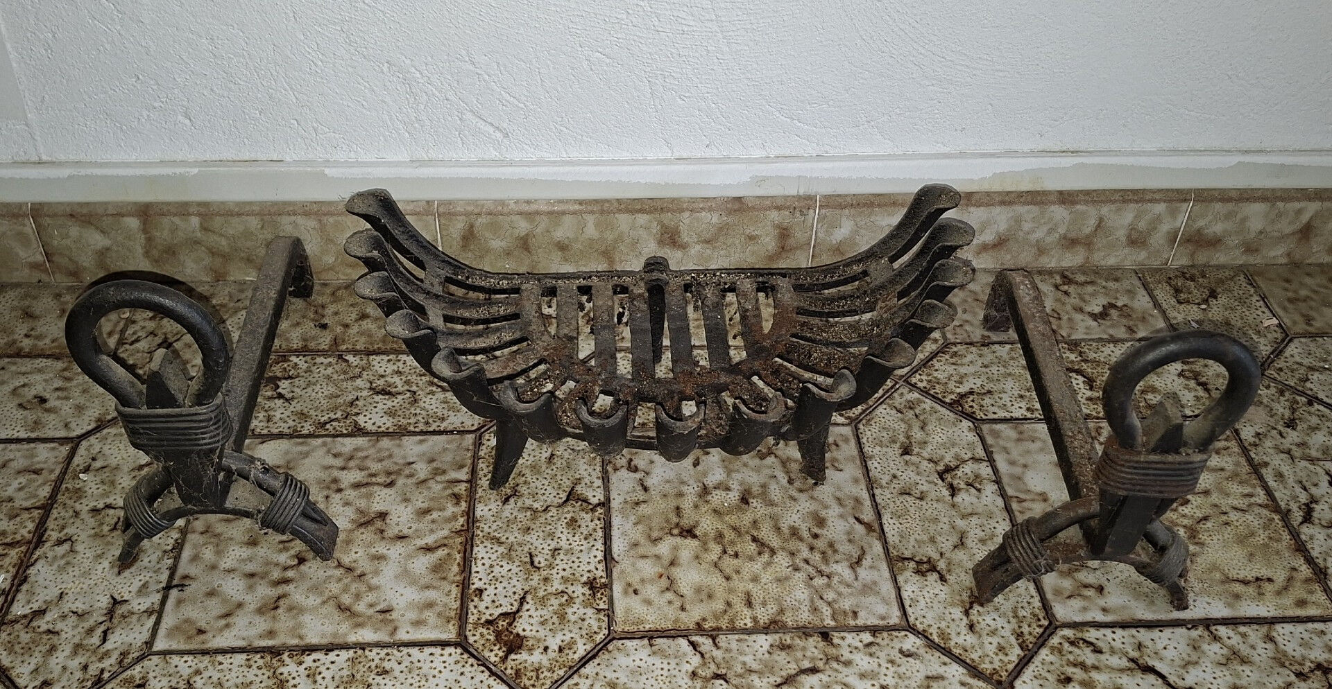 Important wrought iron fireplace accessories – Andirons and log basket