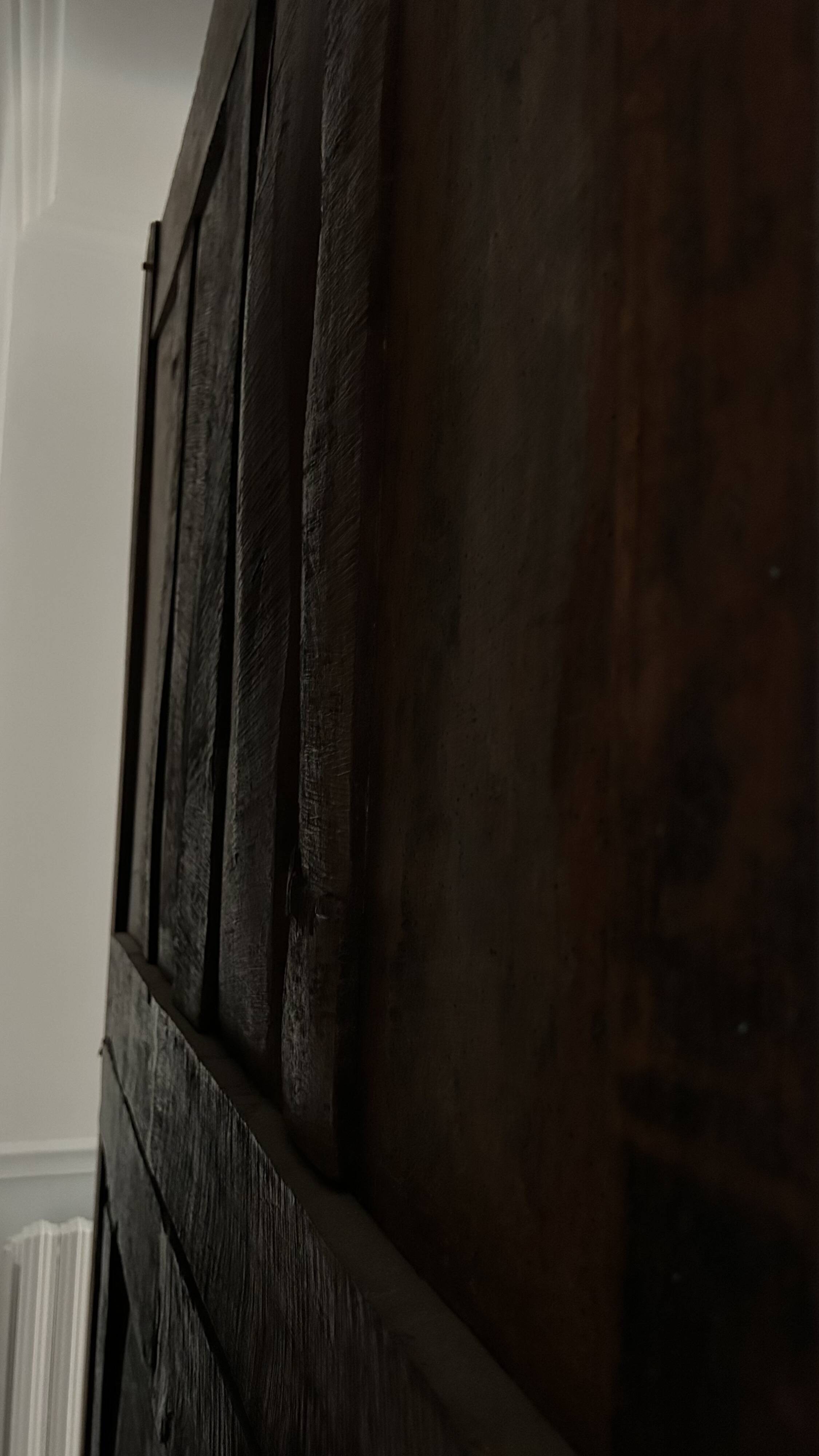 Antique walnut armoire with two doors.