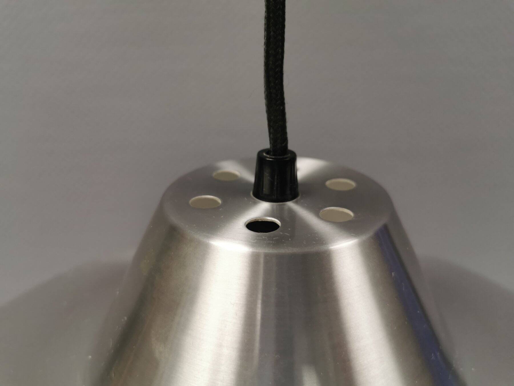 Slim silver-colored hanging lamp with a large diameter. Denmark 1980s