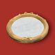 Antique oval mirror in gilded resin with Louis XVI style knot decoration