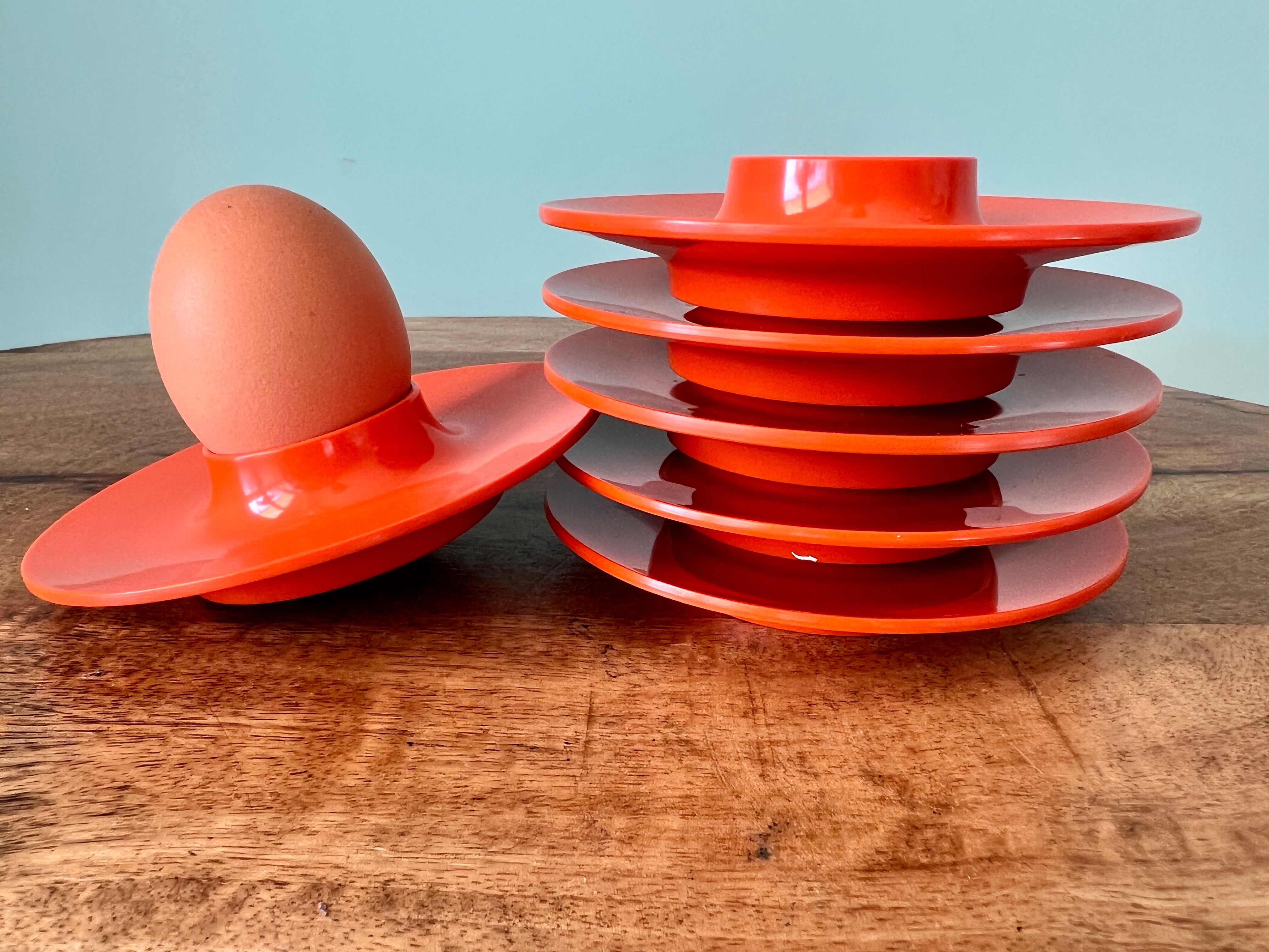 Rosti Mepal set of 6 orange egg cups, space age from Scandinavian design for apartment decoration