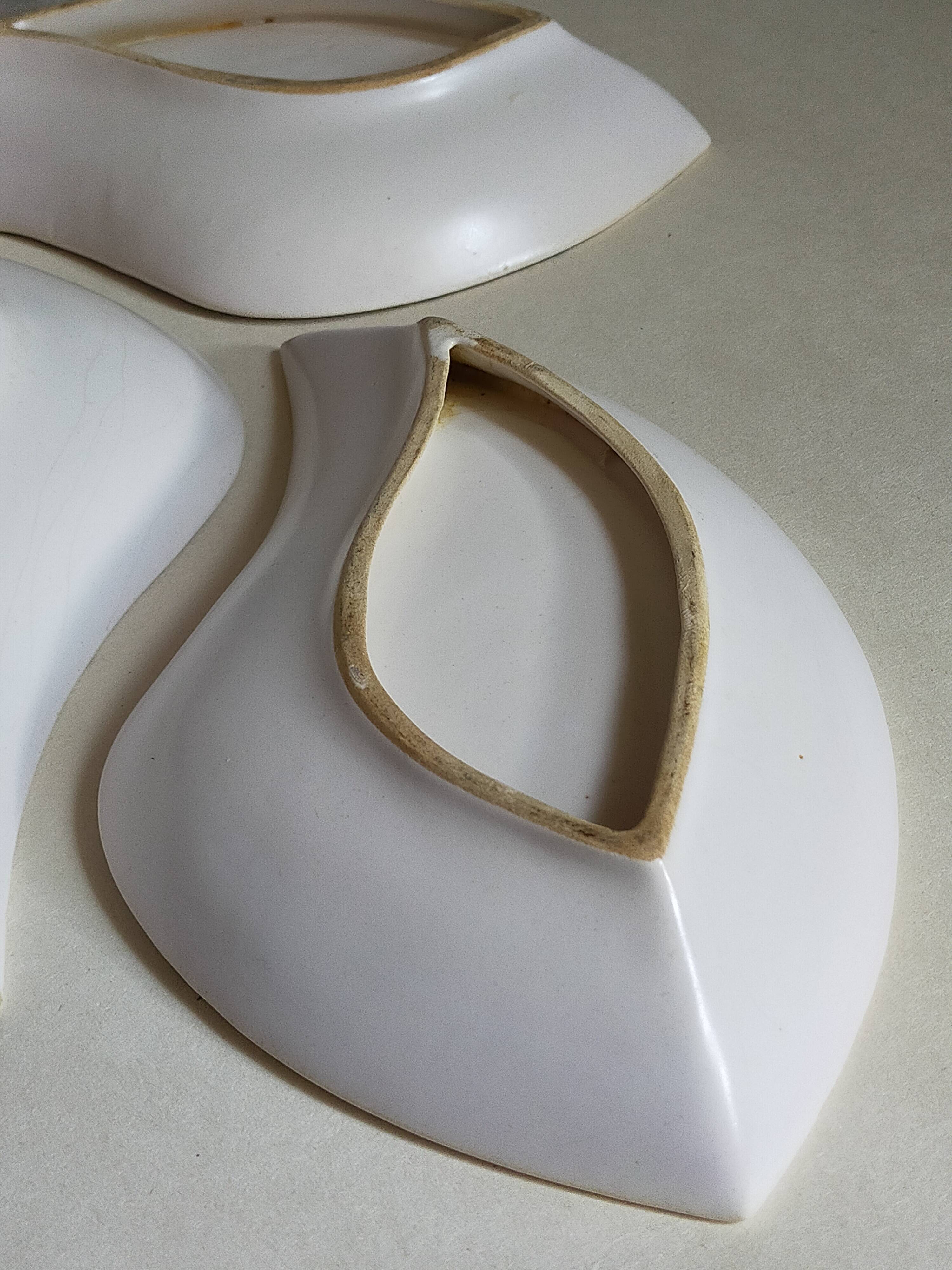 Three vintage free-form ceramic ravine dishes from the 1950s
