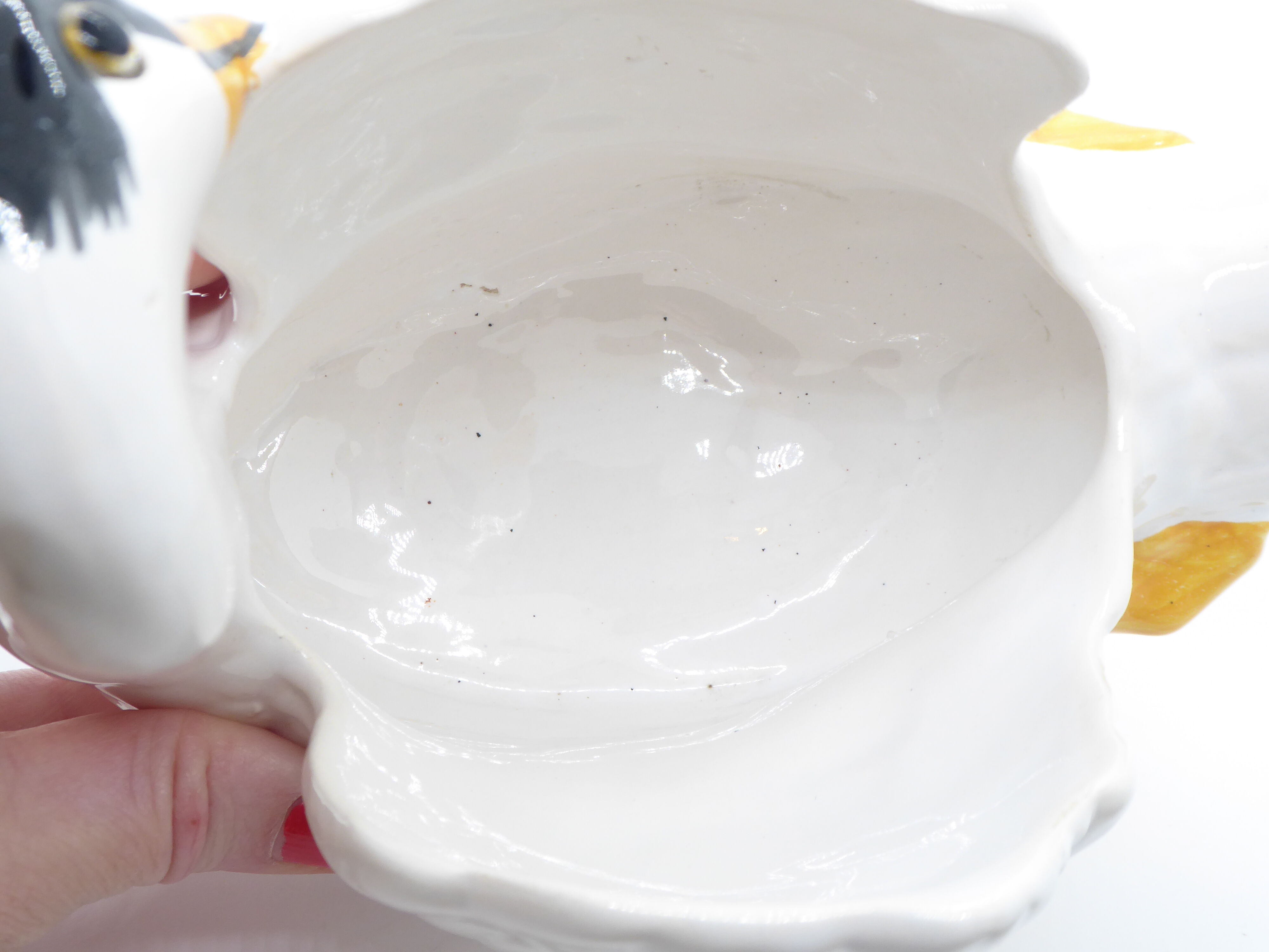 Ceramic pot cover in the shape of a swan