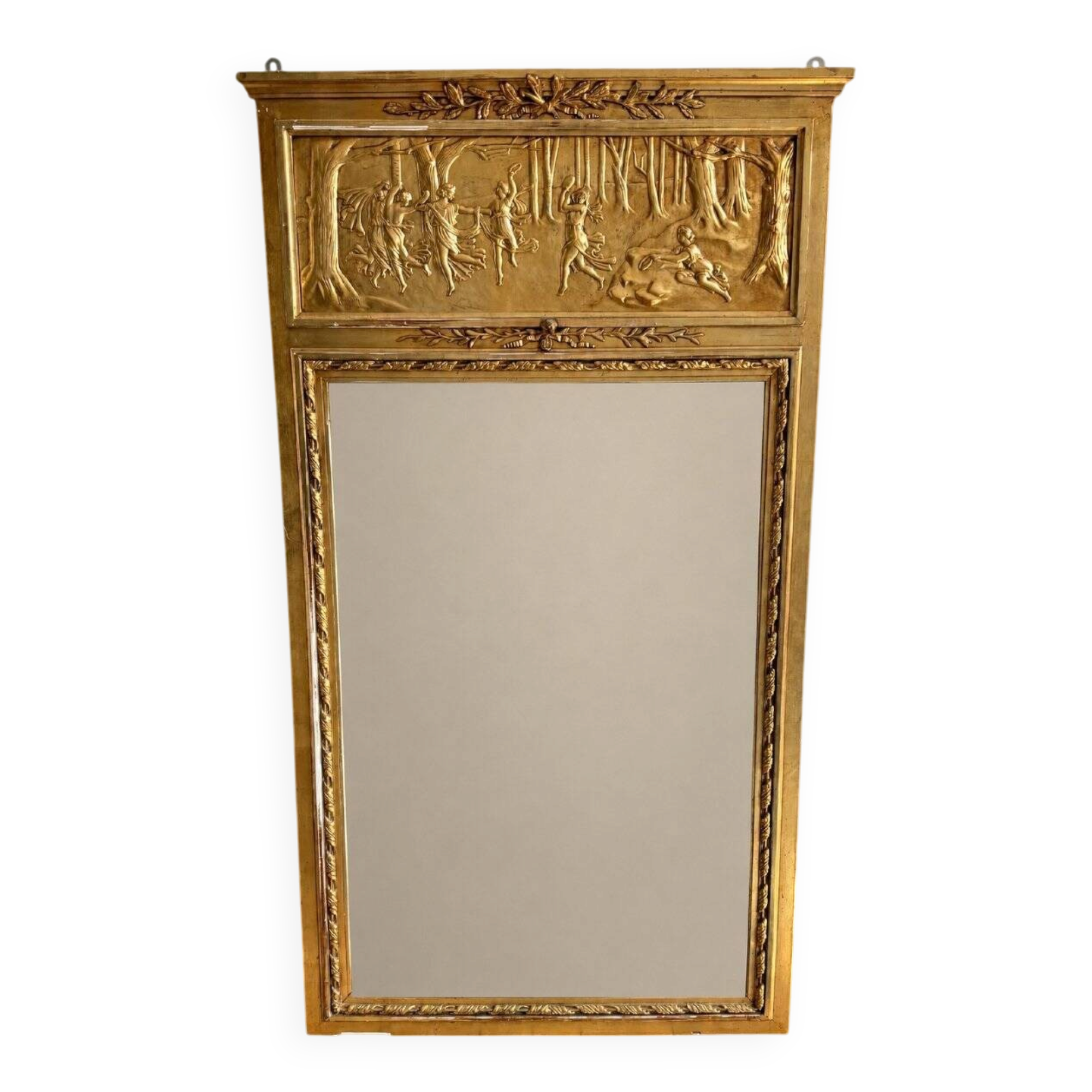 Gilded trumeau in the Louis XVI style with curious decorations.