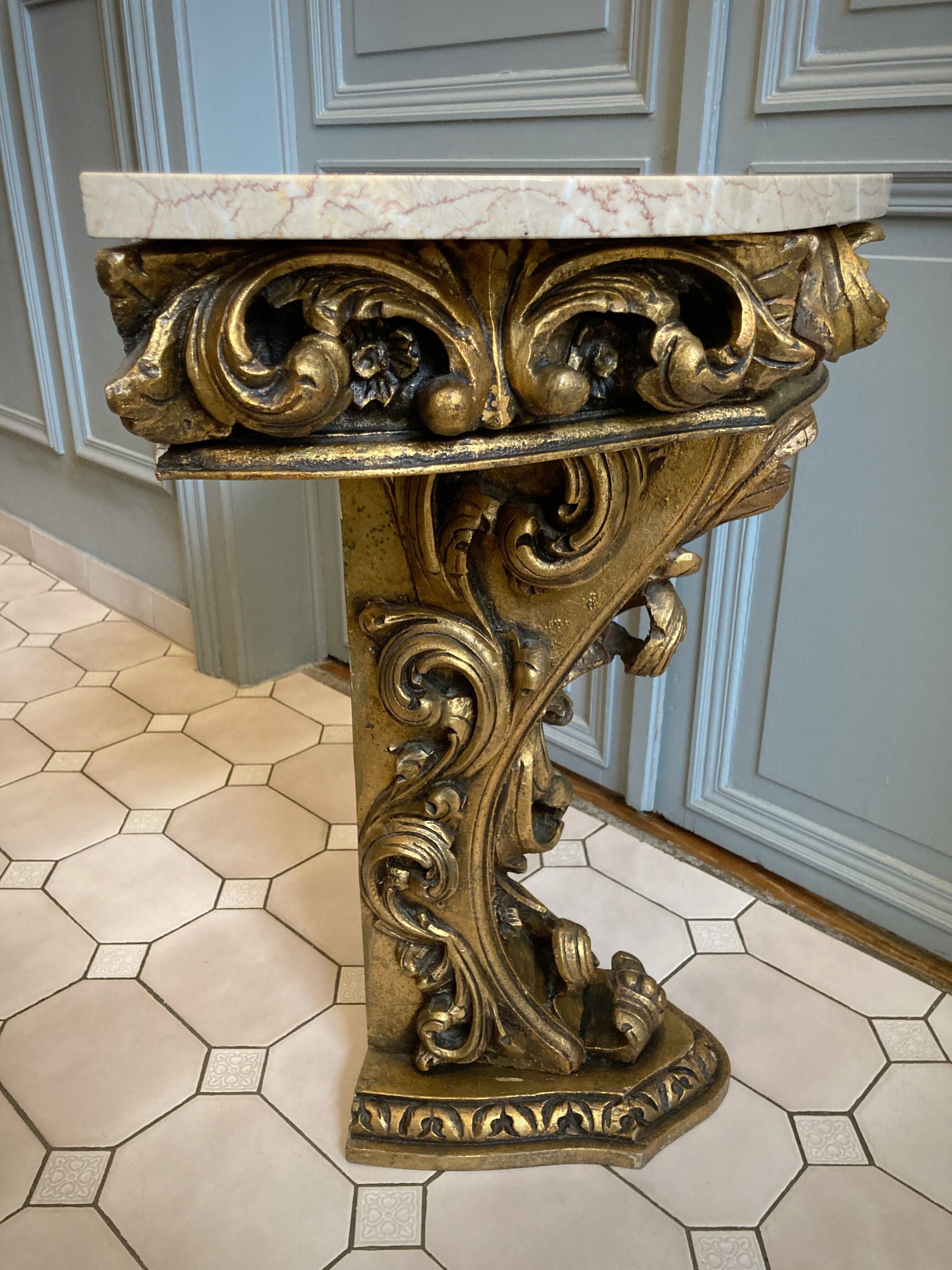 Carved wooden and marble console