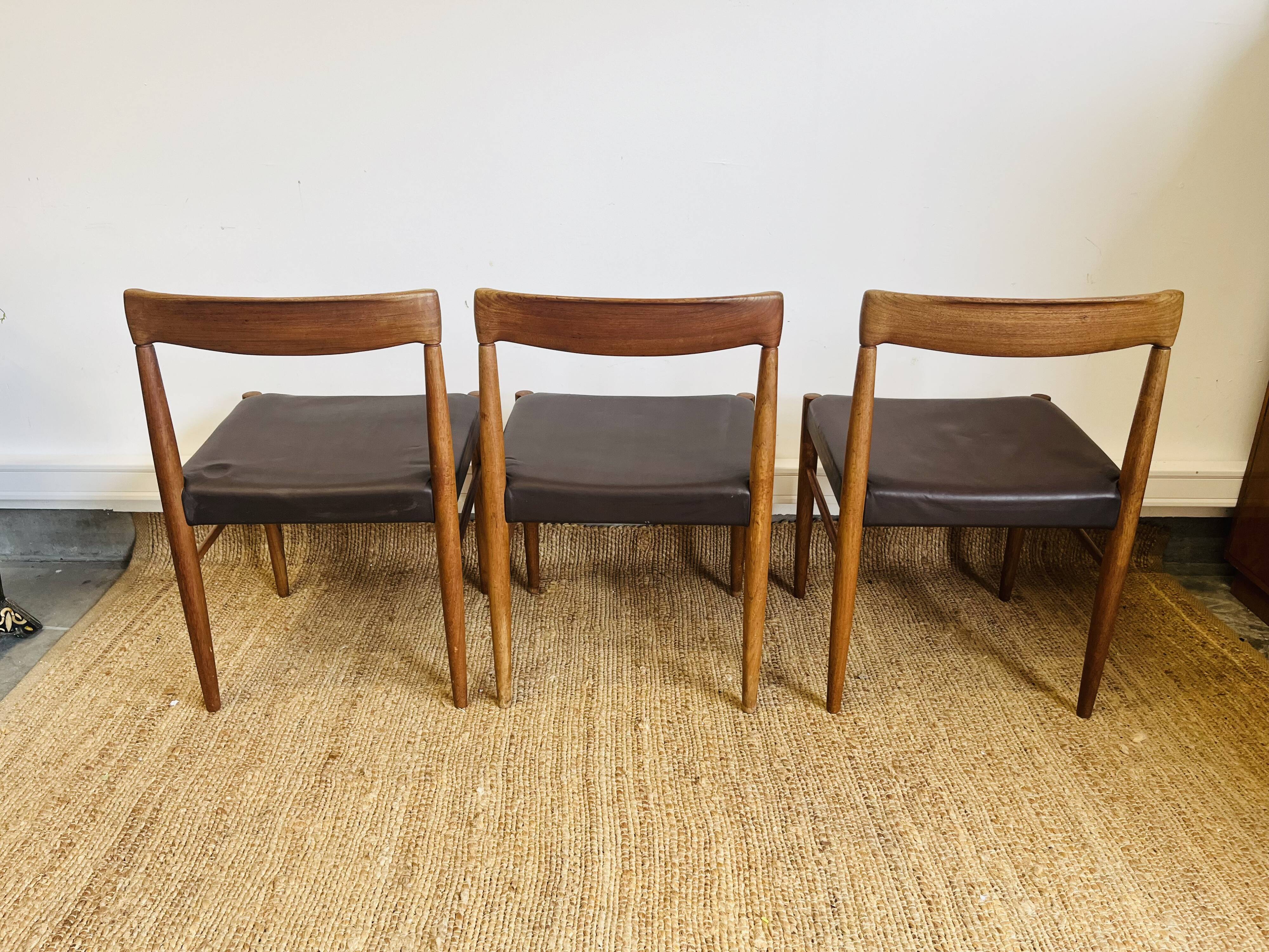 3 vintage Scandinavian chairs in teak and brown leatherette