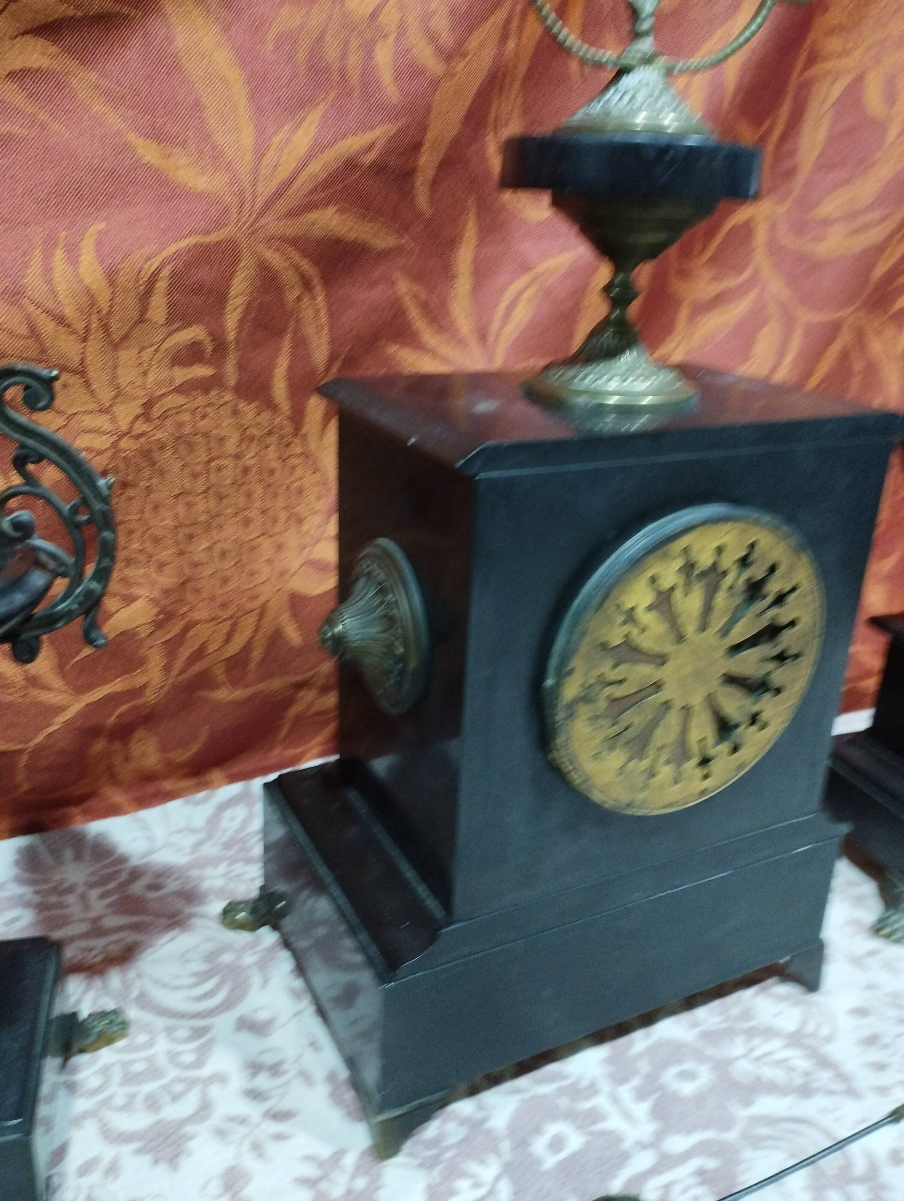 old Napoleon III marble fireplace surround with cups and pendulum