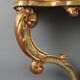 19th-century carved wooden drop-leaf console.