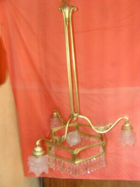 Art Deco period chandelier (1925) with four light arms.