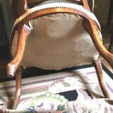 Louis XV period armchair in natural wood with convertible back carved with flowers