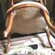 Louis XV period armchair in natural wood with convertible back carved with flowers