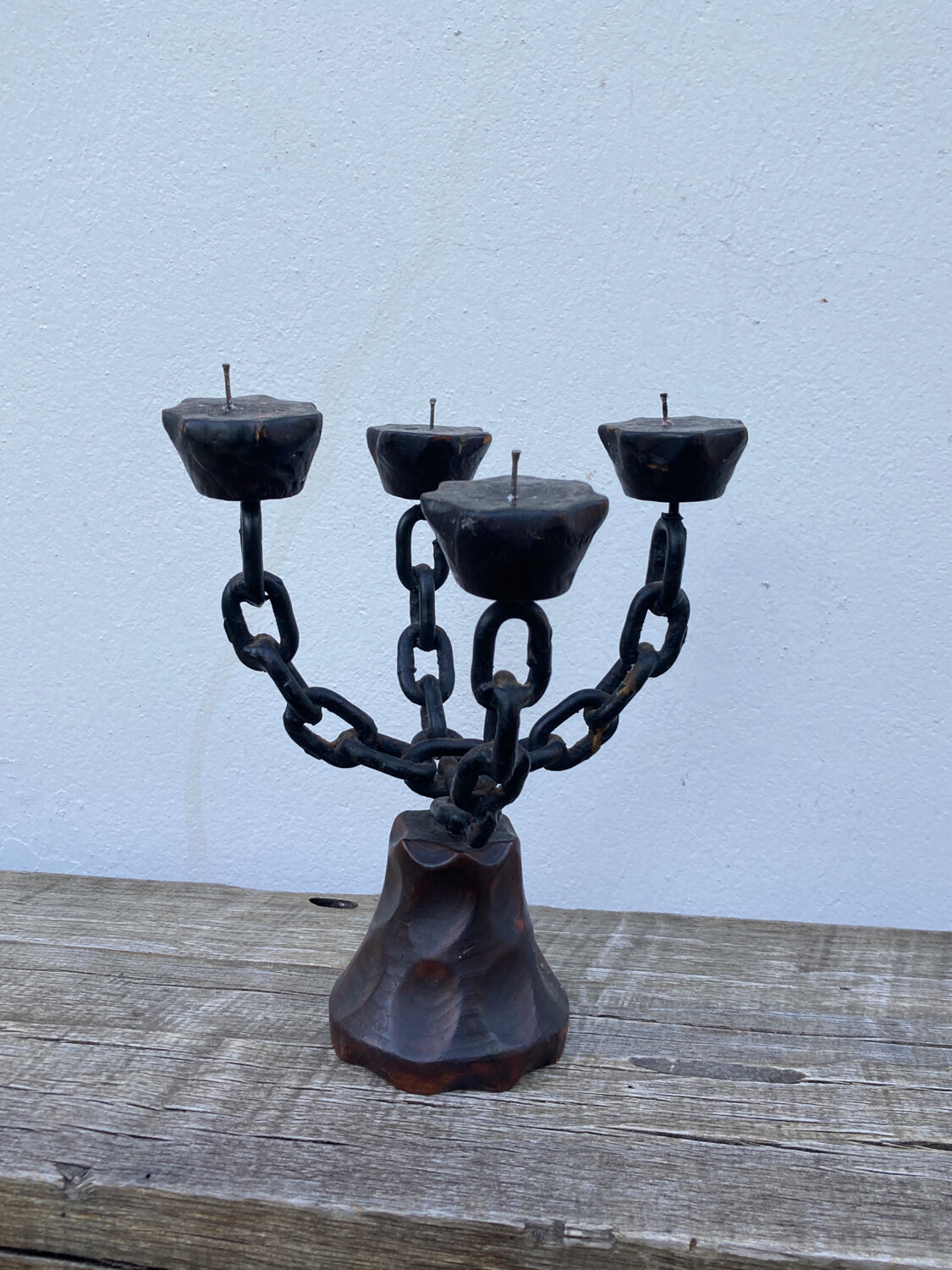 Brutalist iron and wood chain candle holder from the 1970s