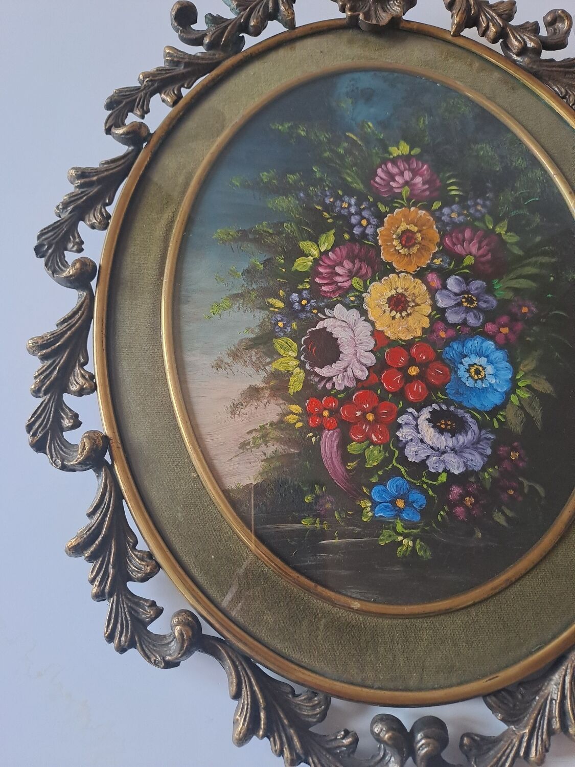 Painted under glass convex medallion in bronze