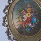 Painted under glass convex medallion in bronze