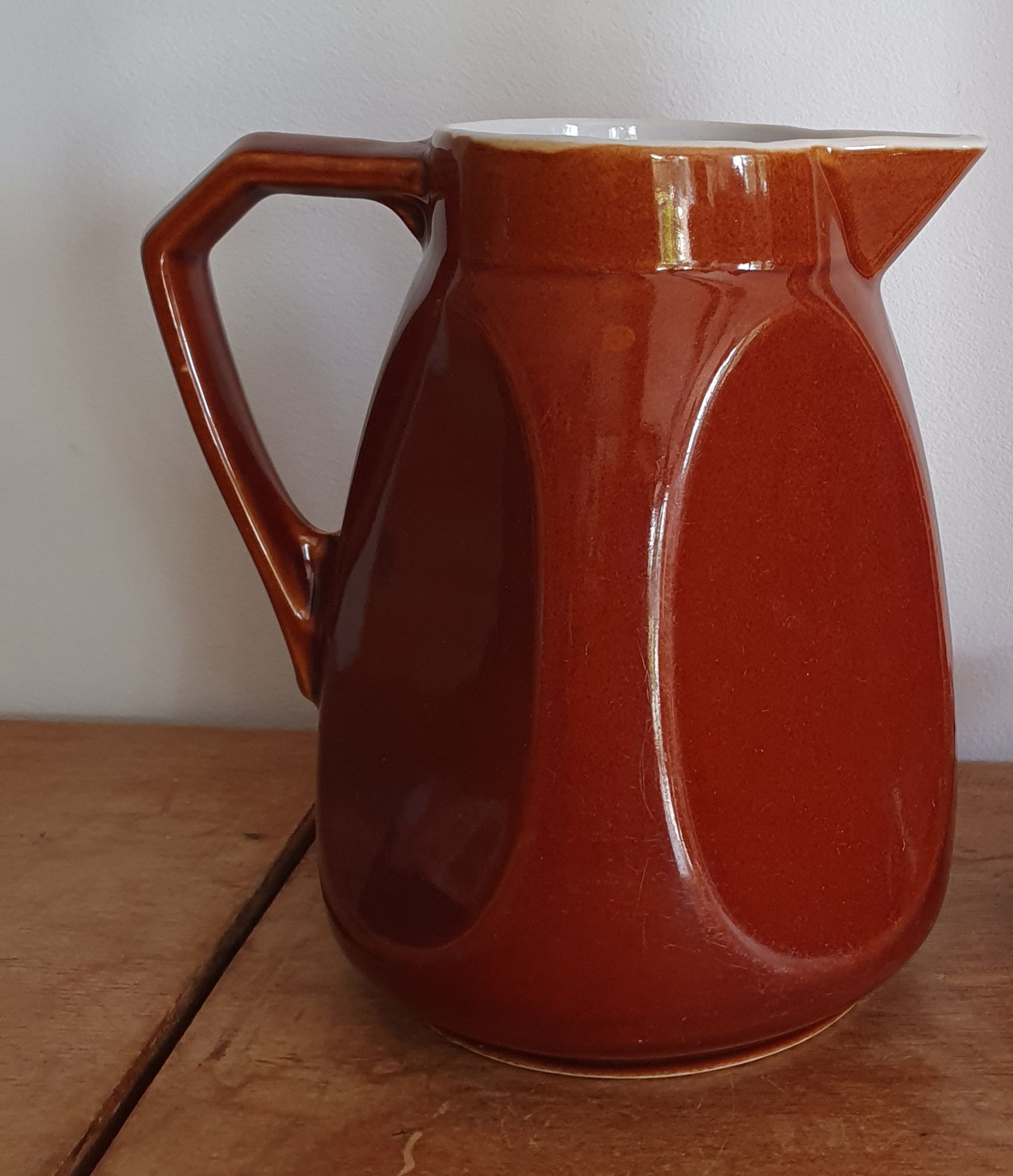 Pitcher in brown sandstone