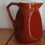 Pitcher in brown sandstone