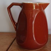 Pitcher in brown sandstone