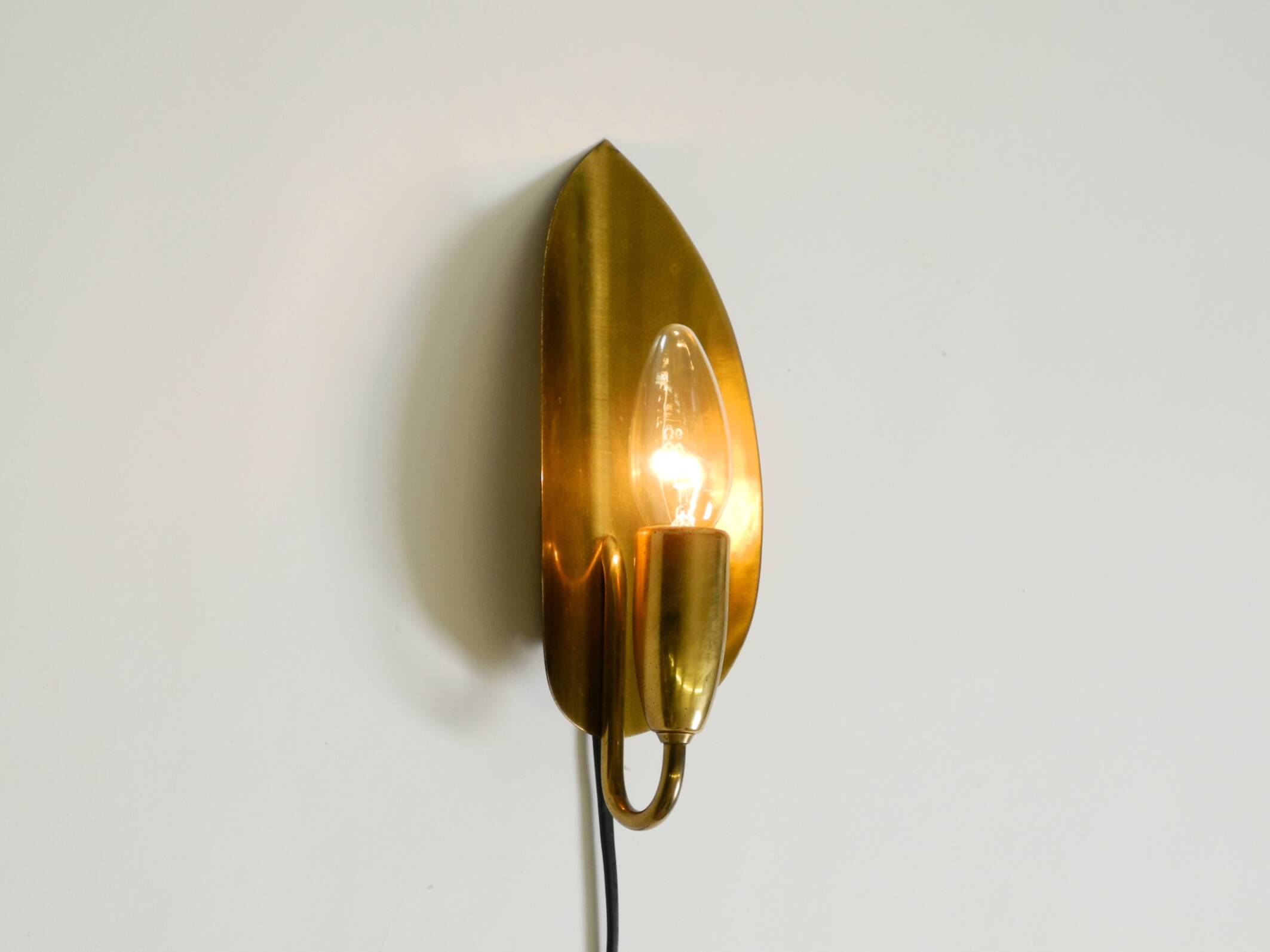 Beautiful original Mid Century Modern cone wall lamp made of brass