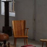 Danish sculpted oak stool from the mid-20th century with a red leather seat, 1950s.