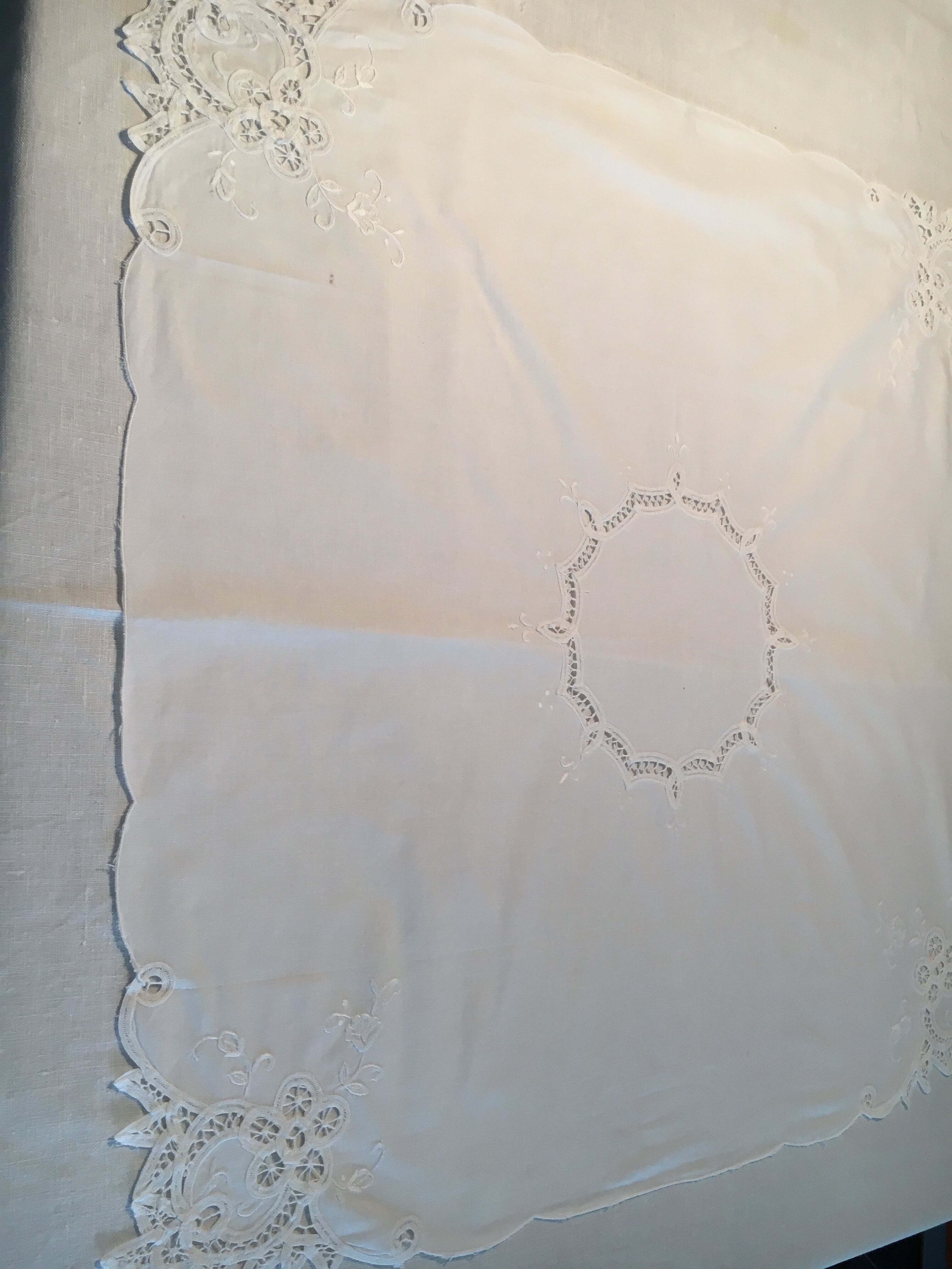 Old embroidered white cotton tablecloth