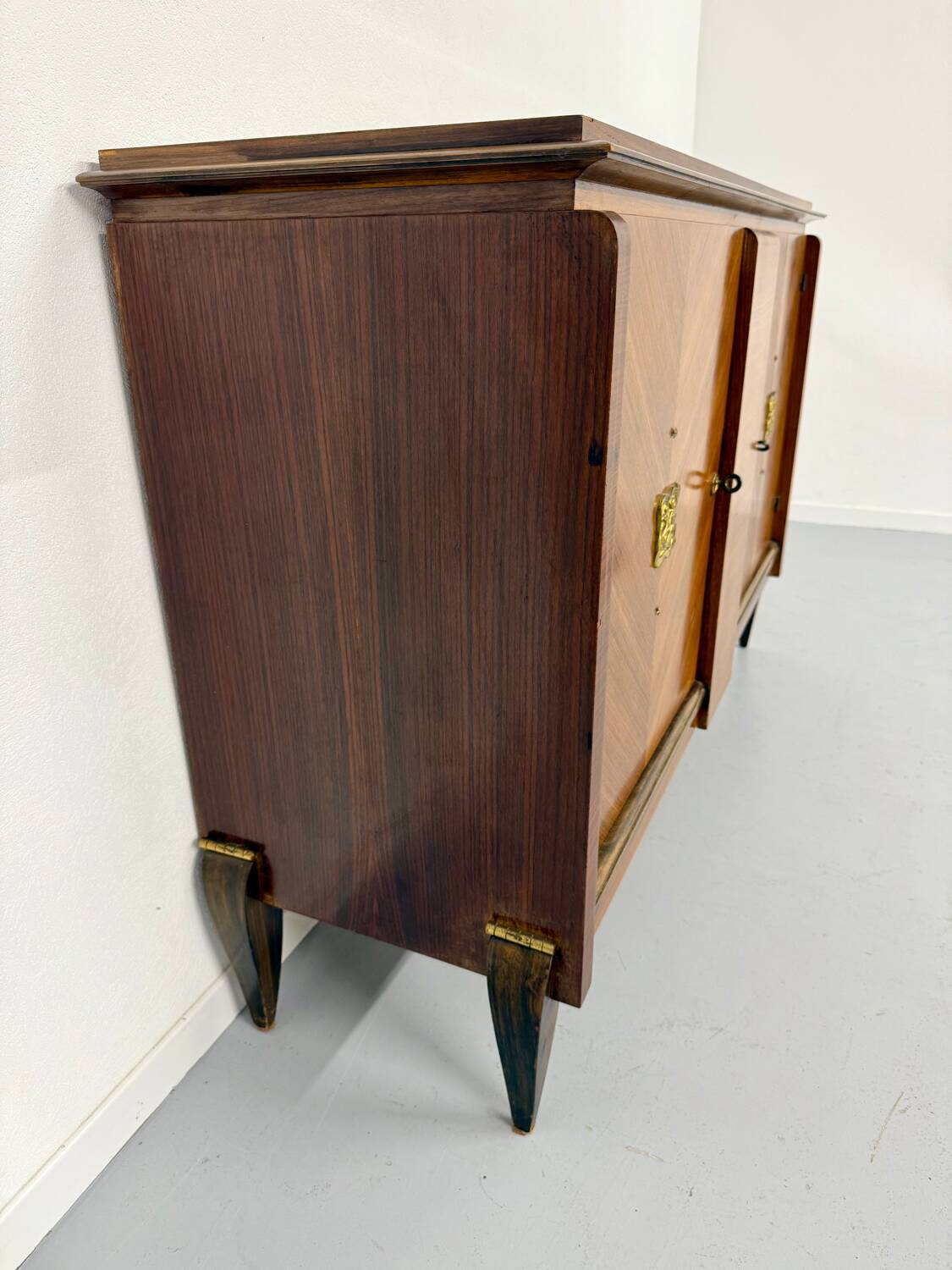 Antique art deco sideboard from the 1930s with veneered wood and bronze insert