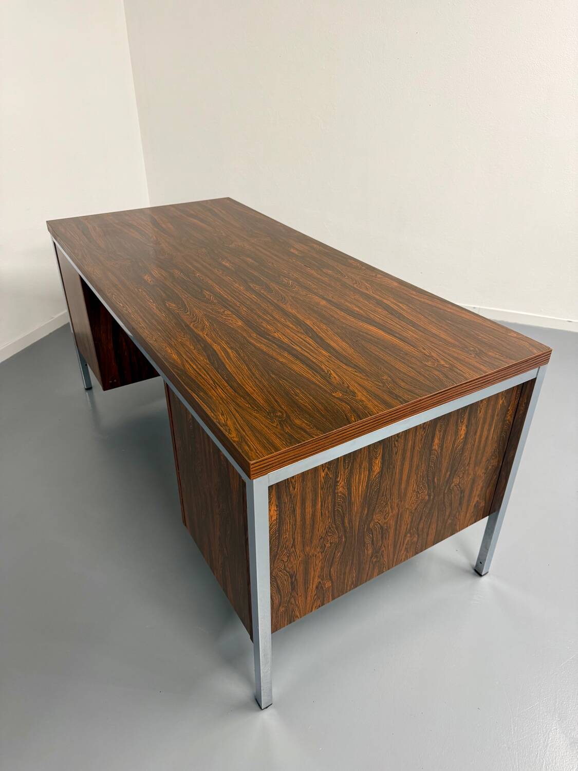 Vintage desk with rosewood veneer and chrome metal design from the 1970s.
