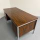 Vintage desk with rosewood veneer and chrome metal design from the 1970s.