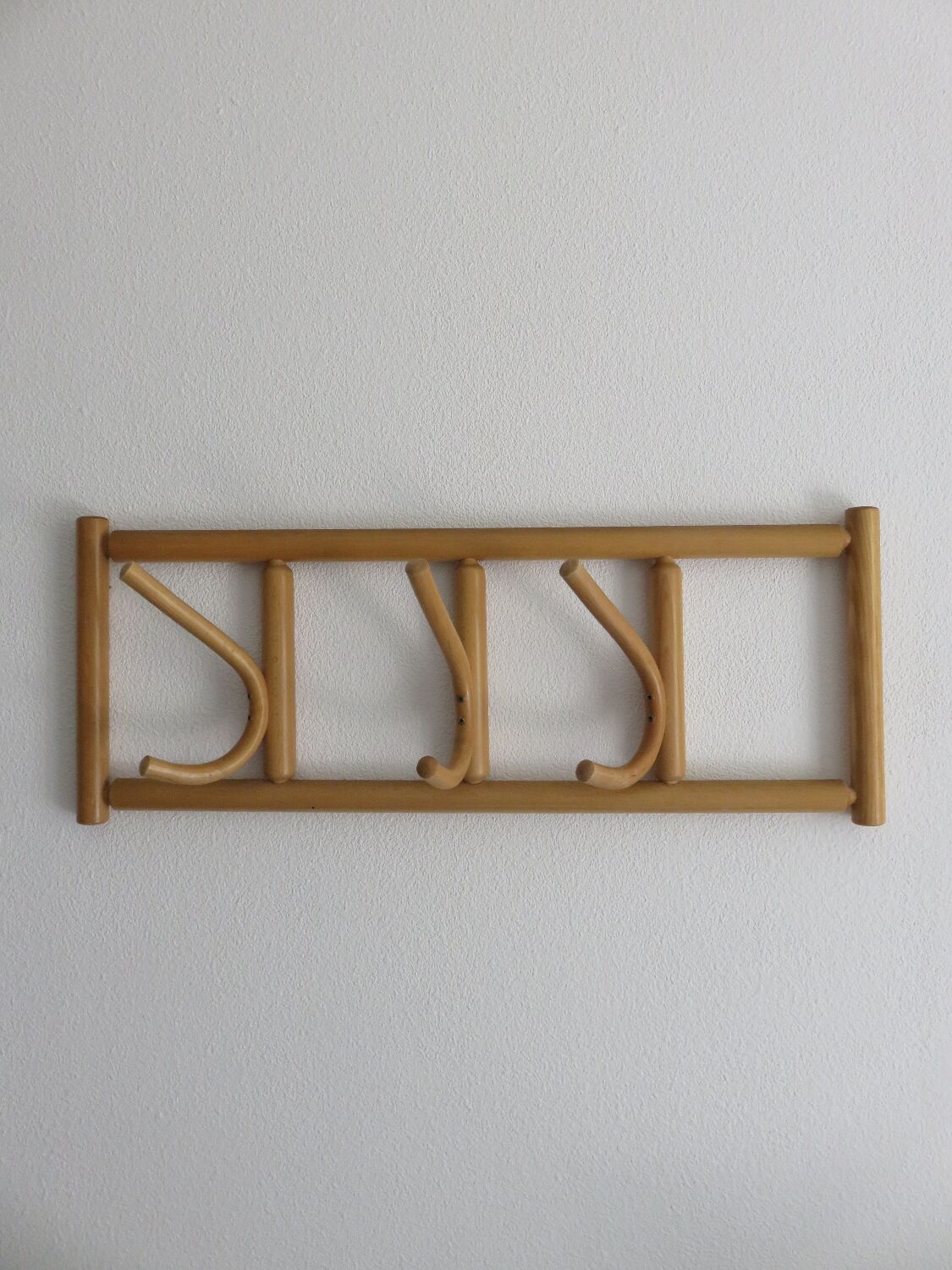 Curved wooden wall coat rack from the 70s-80s.