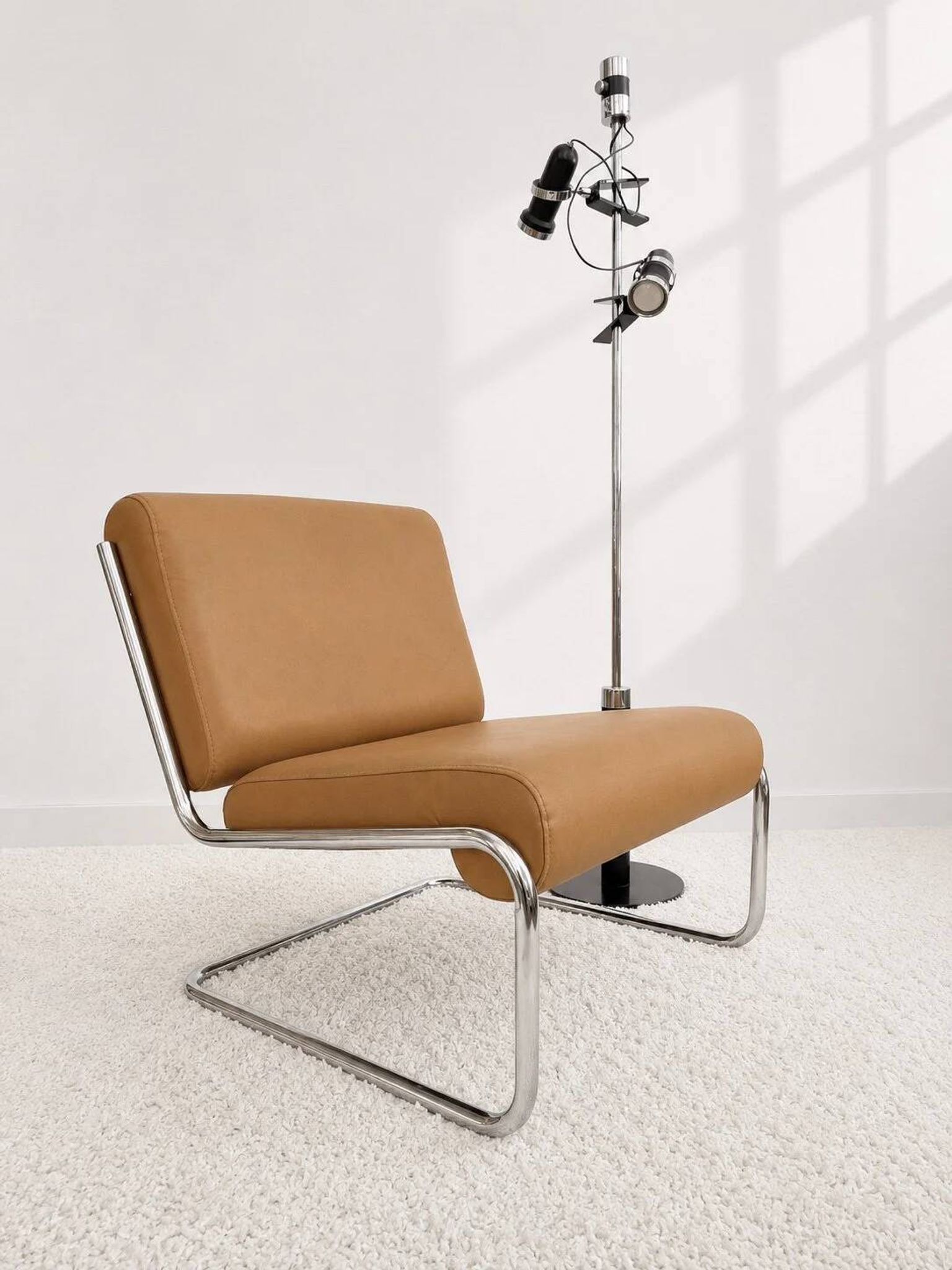 Vintage cantilever armchair. Brown faux leather upholstery. 60s