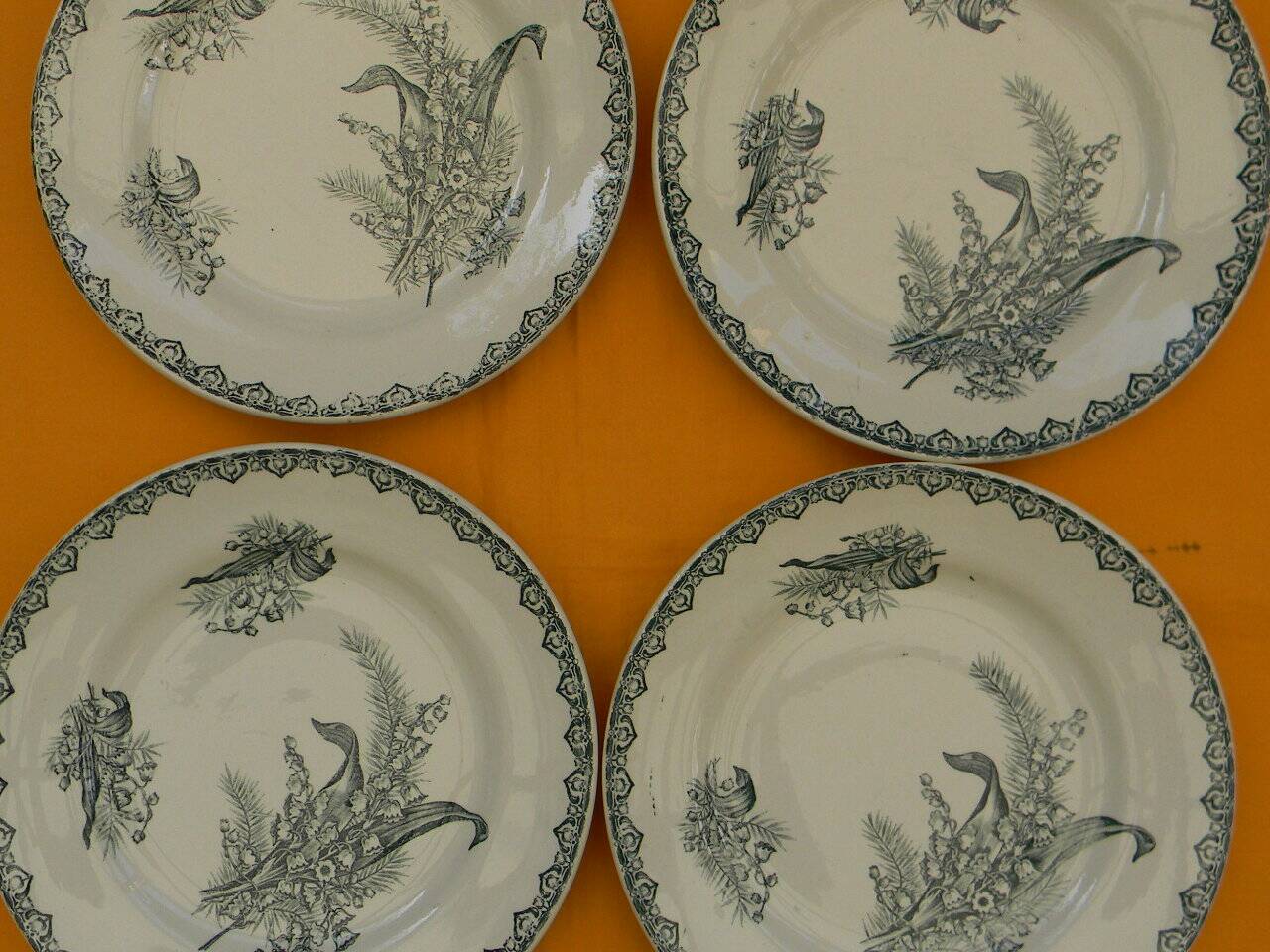 Set of 4 flat plates in saint amand earthenware. lily of the valley decor.