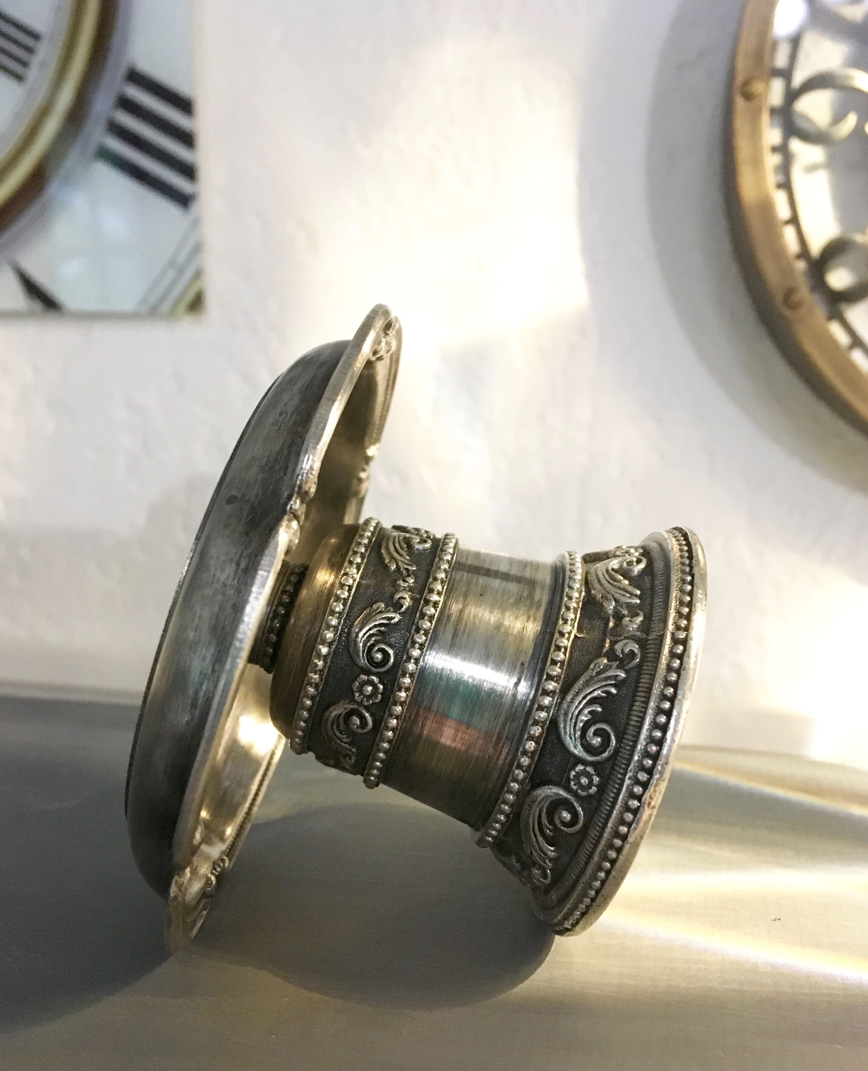 Chiseled silver metal candle holder