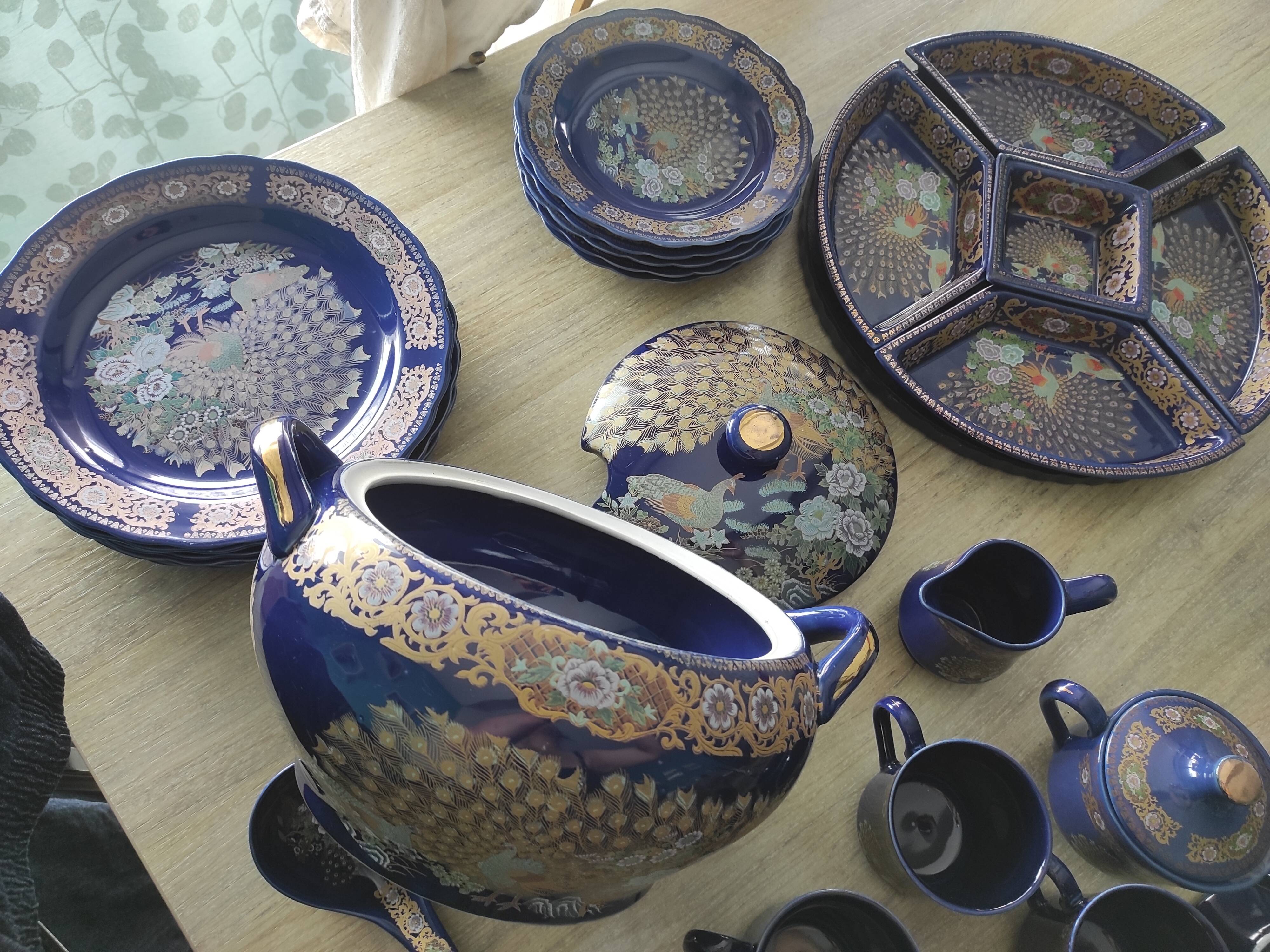 Vintage blue Taous dinnerware set of 21 pieces in very good overall condition.