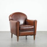 Armchair made of sheepskin leather in art deco design with warm colours
