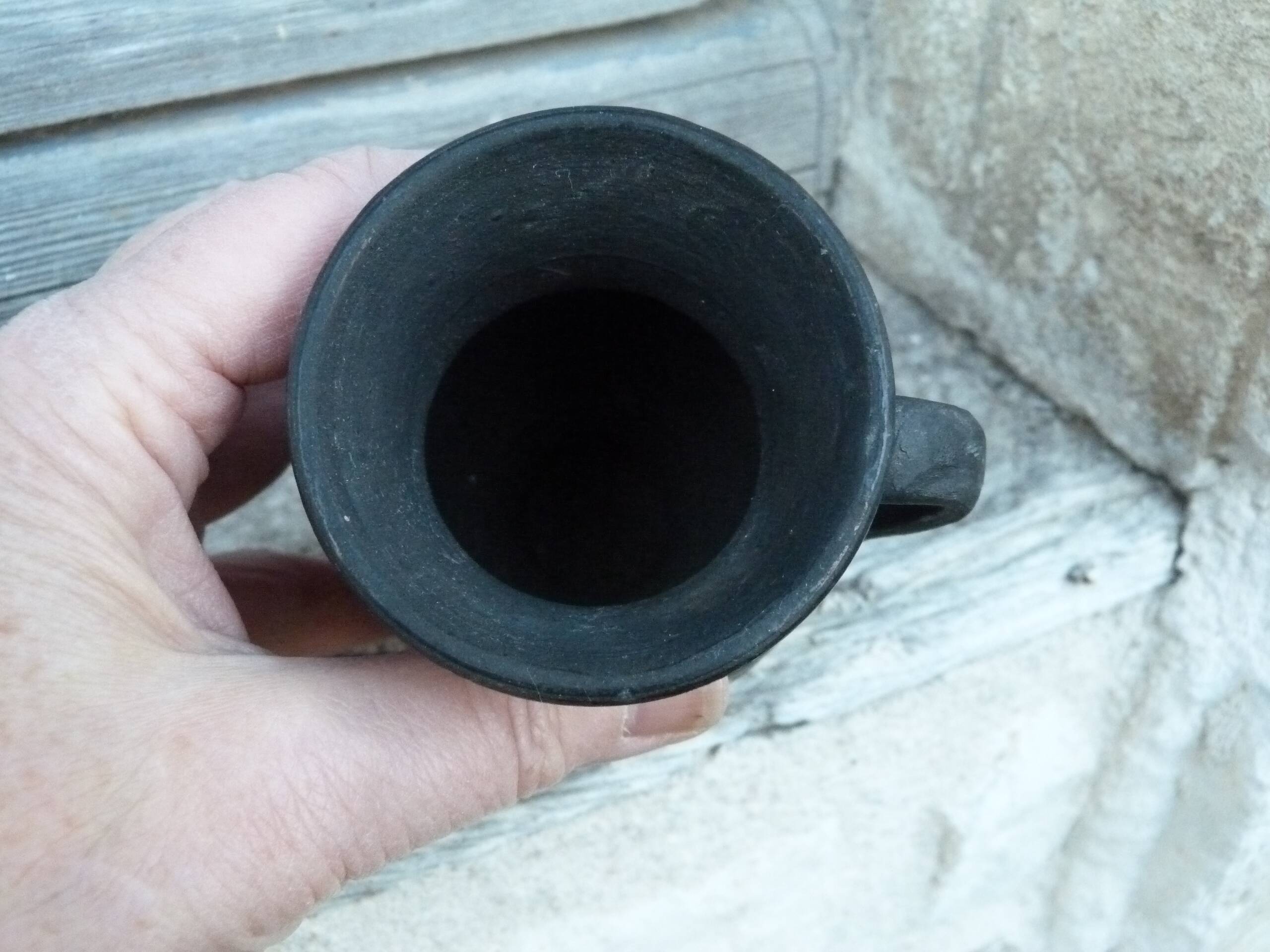 Pitcher in matte and glossy black pottery