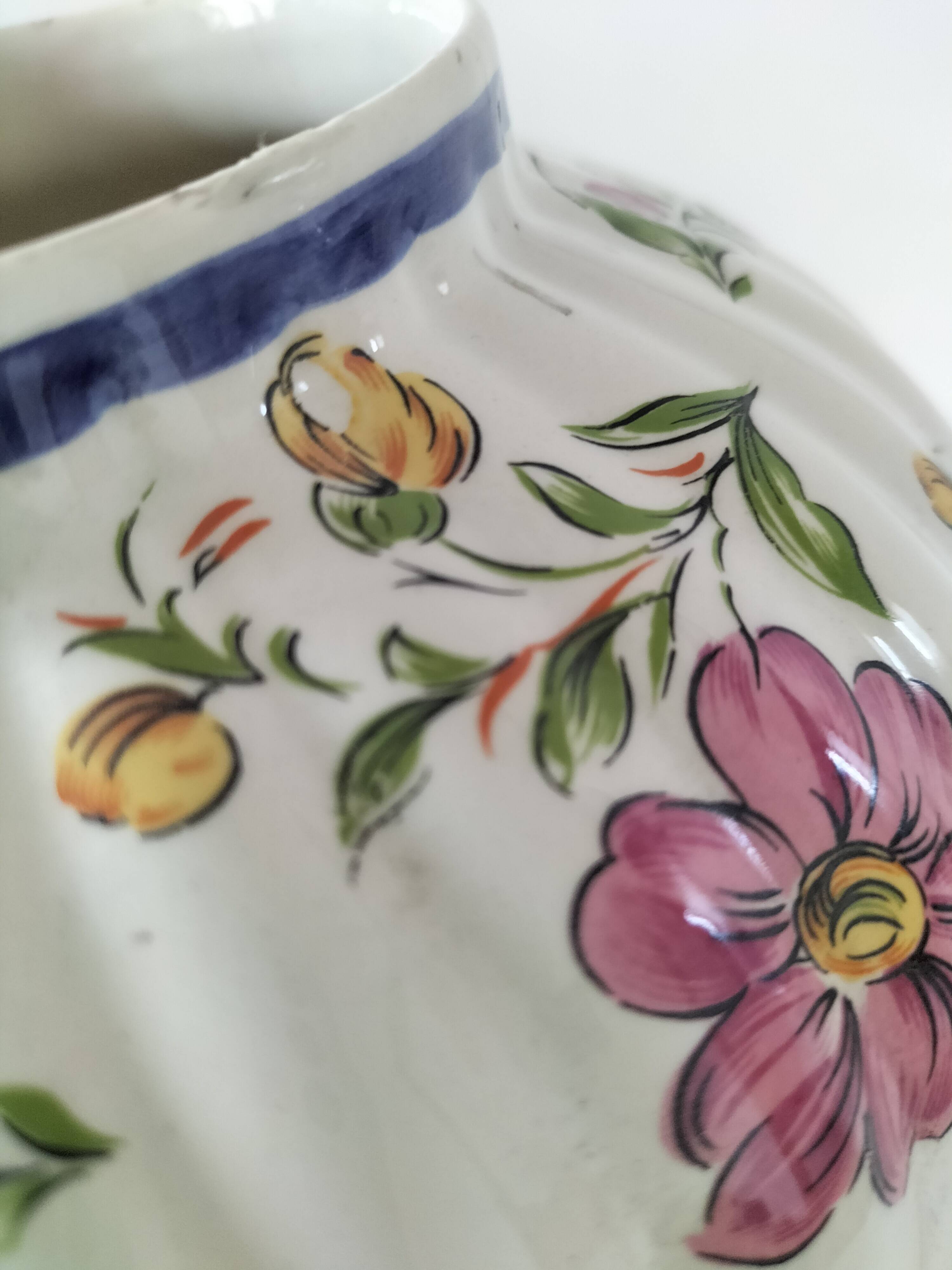 Antique vase with floral decoration in enamelled earthenware – timeless charm
