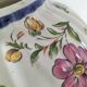 Antique vase with floral decoration in enamelled earthenware – timeless charm