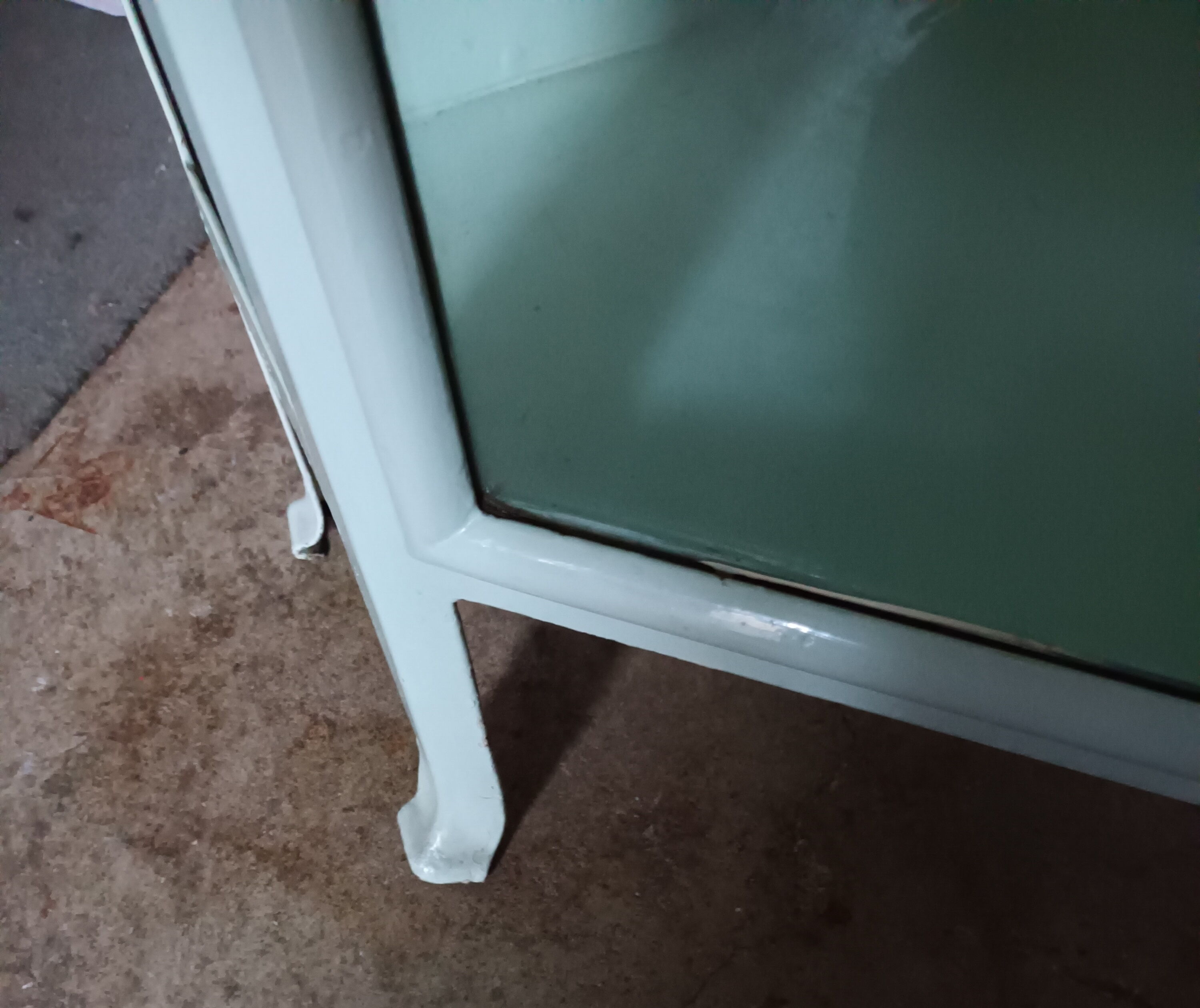 Painted metal ophthalmologist's corner display case, early 20th century