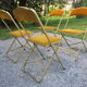 Série de 4 chaises pliantes métal doré et tissus