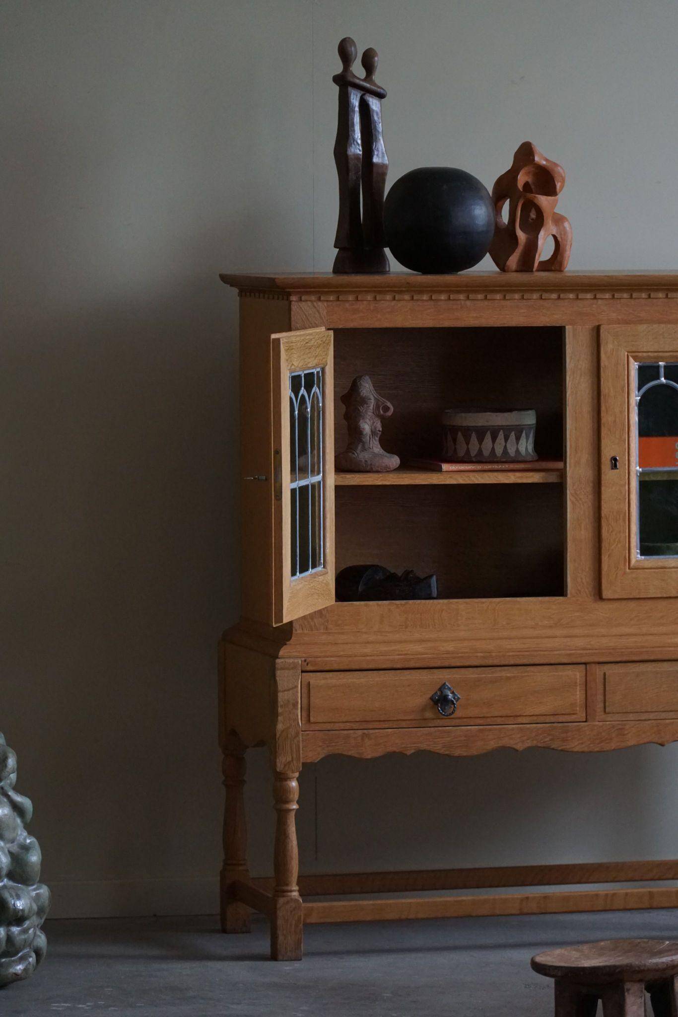 20th-century solid oak display cabinet with a glass front, by a Danish cabinetmaker.