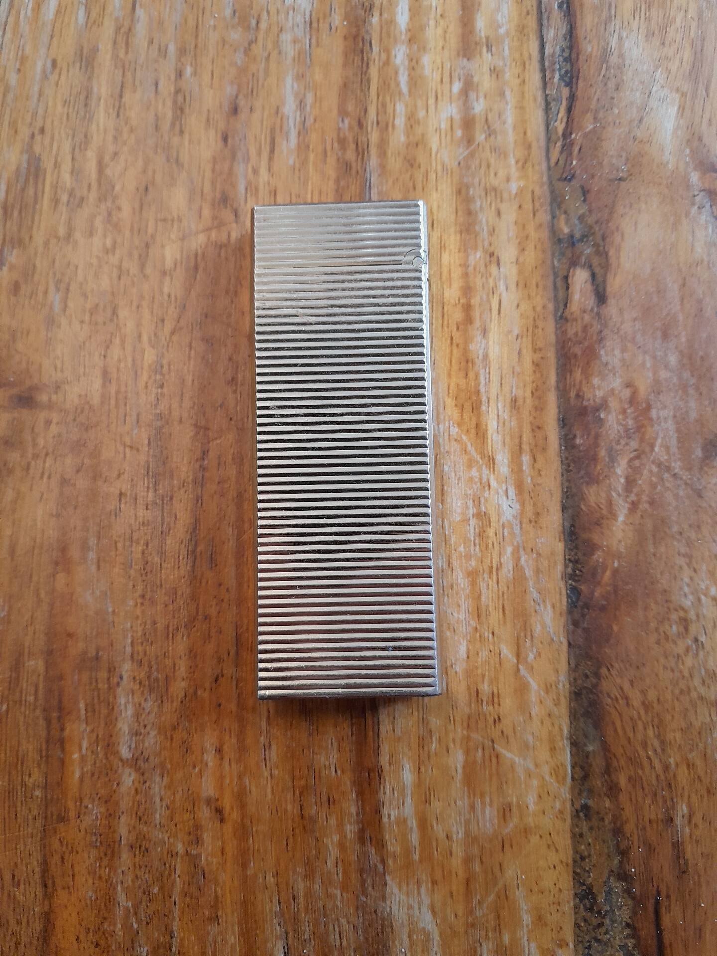 Vintage Pierre Cardin gold lighter, 1970s-80s.