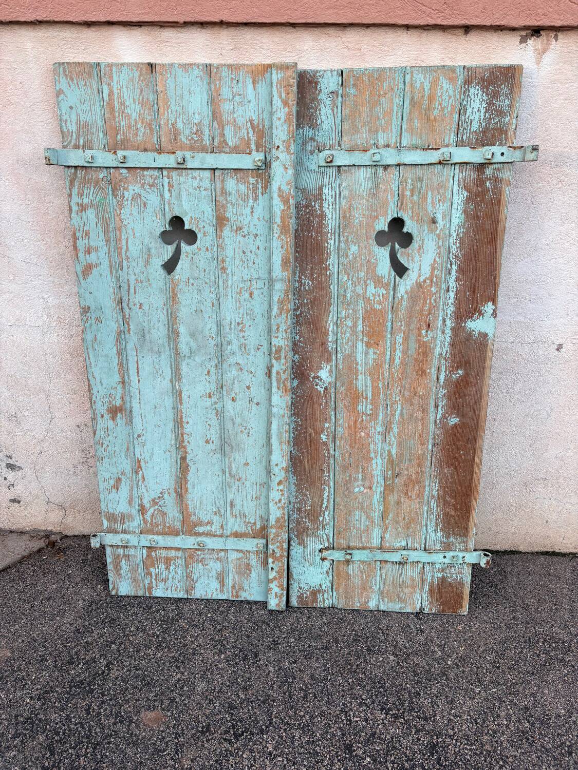 Pair of green wooden shutters