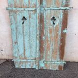 Pair of green wooden shutters